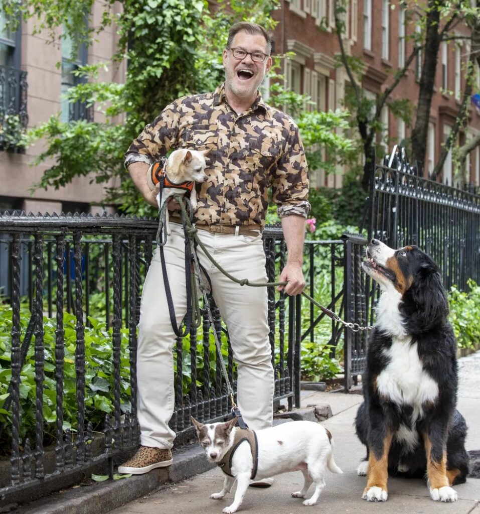 Bartlett with his three dogs outside his W24th st apartment