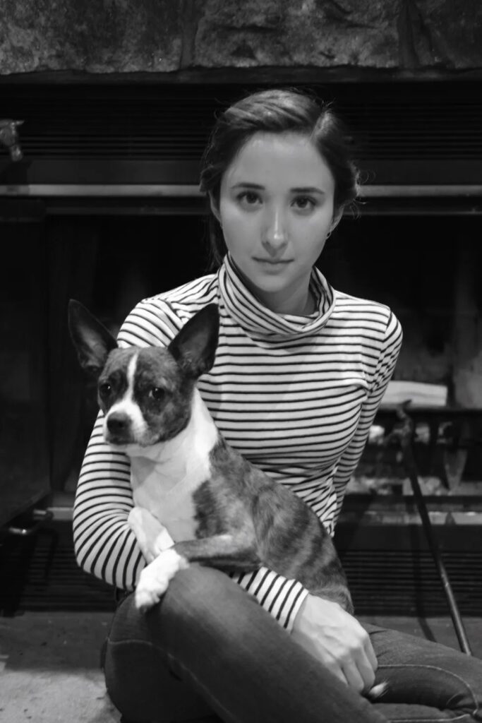 Black & White image of Victoria posing with her first rescue pup, Rue - Love, Dog
